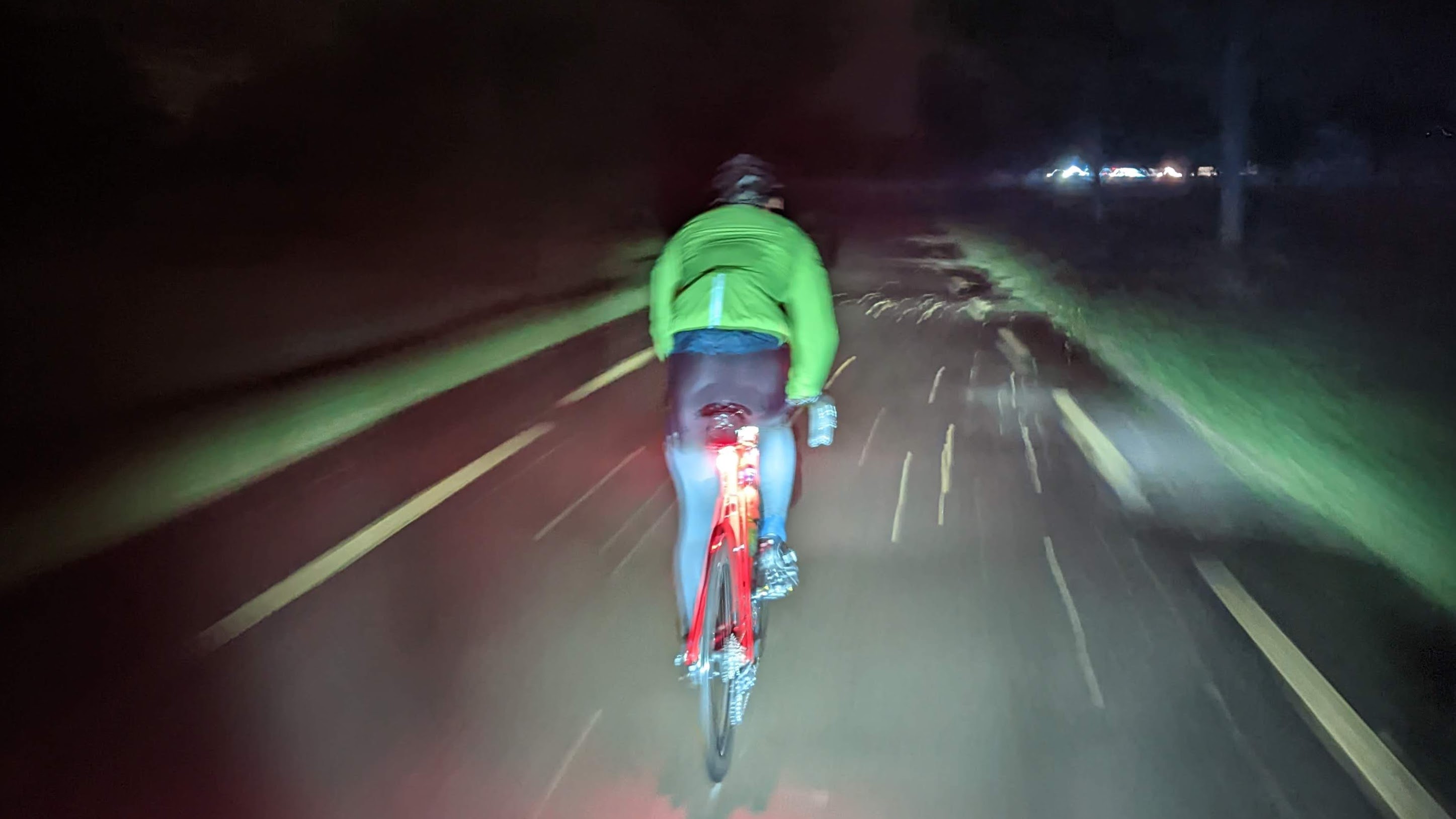 Cyclist biking through the rain